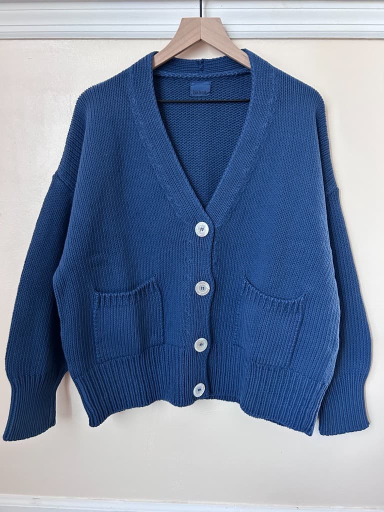 Blue knit cardigan with patch pockets